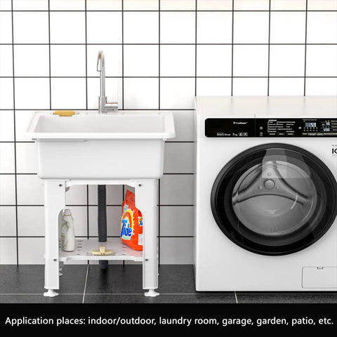 Freestanding Plastic Laundry Sink With Detachable Washboard For Indoor And Outdoor Use 25.4 Inch Wide By 22 Inch Deep By 31.5 Inch Tall Utility Sink With Cold And Hot Water Faucet Hoses And Drain Kit For Laundry Room Garage Basement Garden next to a washing machine in a tiled room.