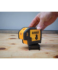 Professional Grade Self Leveling Laser Level Built Tough For The Jobsite shown in use on a wooden surface with micro adjustment knob.