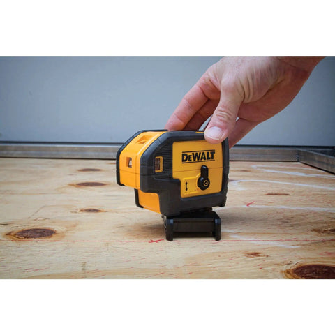 Professional Grade Self Leveling Laser Level Built Tough For The Jobsite shown in use on a wooden surface with micro adjustment knob.