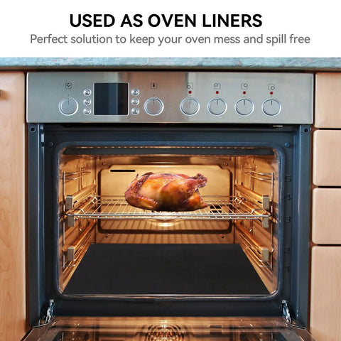 Open oven with a chicken roasting, showing 2 Pack Large Stove Burner Covers Cuttable 31x17.7 Inches Nonstick Teflon Oven Liners Mat inside.