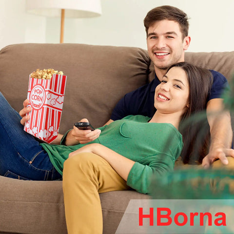 Couple on sofa with popcorn using Heavy Duty Paper Popcorn Bags 1 Oz Individual Servings 500 Pack For Popcorn Machines.
