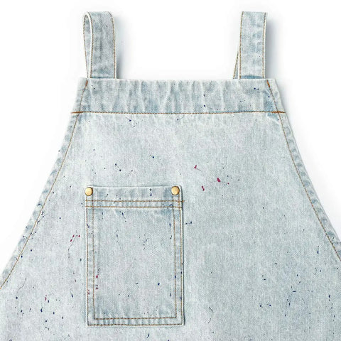 Close-up of Denim Tool Shop Apron For Hairstylists With Five Pockets, adjustable from S to M, light blue painted denim