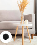 Lock Tight Adhesive Felt Pads For Furniture Legs 312 Pack round black felt pad on a table leg in a cozy living room setting.