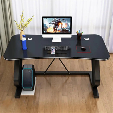 Game Ready Multifunctional Computer Desk With Built In Phone And Drink Slots Curved Gaming Table featuring a matte black finish and drawer storage.