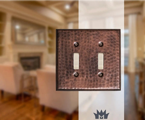 Hand Hammered Copper 2 Gang Light Switch Cover Plate Made To Last With A Rich Patina Over Time shown in a living room setting