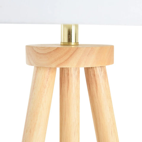 Close-up of rubber wood base on Dope Mid Century Modern Tripod Floor Lamp With Linen Shade In Natural And Cream Rubber Wood Base