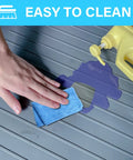 Hand cleaning 34 Inch By 22 Inch Under Sink Mat Waterproof Silicone Drip Tray with Drain Hole and liquid spill.