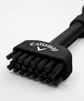 Black Mini-Mag Magnetic Club Brush for Golf, Compact Groove Cleaner With Detachable Magnet, Durable Nylon Bristles in close-up view.