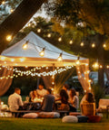 Outdoor String Lights 29 Feet G40 LED Patio Lighting Plug In With 13 Plastic Edison Bulbs And 1 Spare hanging at night over a party scene