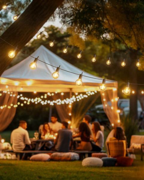 Outdoor String Lights 29 Feet G40 LED Patio Lighting Plug In With 13 Plastic Edison Bulbs And 1 Spare hanging at night over a party scene