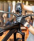 Person using Two Piece T Handle Ball End Hex Key Wrench Set 4mm Metric S2 Steel on a bicycle handlebar in a workshop