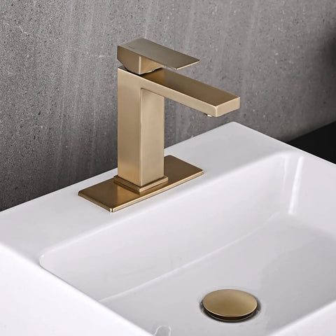 Brushed Gold One Hole Bathroom Faucet With Pop Up Drain mounted on a white sink, showing slick single handle and modern waterfall spout.