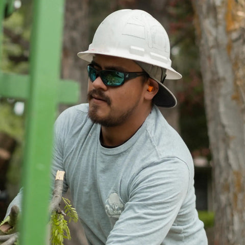 Construction worker wearing Kazbek Torque Polarized Anti Fog Vapor Shield Safety Glasses with Smoke Lens.