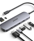 All In One USB C Hub 7in1 For Laptops And MacBook Type C Devices With 4K 60Hz HDMI 2 USB 3.0 Ports USB C Data Port SD And TF Card Readers 85W PD Pass Through For Fast Clean Desk Setup showing multiple connected cables and cards