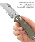 Hand holding Folding Utility Knife With 2.62 Inch Razor Blade, Green Micarta Handle and pocket clip