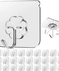Heavy Duty Sticky Hooks No Drill Hassle, Clear Self Adhesive Wall Tacks For Kitchen Bathroom And Shower, Strong Waterproof Backing With Kickass Grip That Holds Your Heavy Gear Down Tight, 28 Pack Bundle showcasing clear hooks.