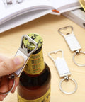 20 Pack Sublimation Keychain Blanks With Bottle Opener in use on a bottle cap, aluminum metal key rings visible