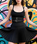 Premium Punk Leather Harness Belt For Women Adjustable Corset Waist Strap worn over a black tank top and pleated skirt against graffiti.