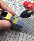 Rock Solid Stainless Steel Hobby Craft Ruler For Model Building And Engraving being used for precise detail marking on a model part.