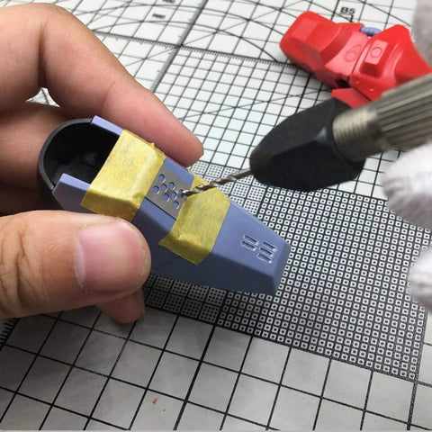 Rock Solid Stainless Steel Hobby Craft Ruler For Model Building And Engraving being used for precise detail marking on a model part.