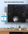 Hella Spaced Surge Protector Power Strip With Flat Plug Extension Cord And 5 Foot Cord mounted on wall behind TV with screws included.