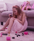 Girl painting nails under pink LED neon 'Nails' sign for nail salon and beauty room decor, USB powered neon light.
