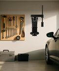 Wall Mount Jack Stand Organizer For Hydraulic Floor Jacks installed in garage next to tool rack and car