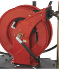 Heavy Duty Pneumatic Oil Pump Kit With 50 Foot Retractable Air Hose Reel 3.7 GPM close-up of red hose reel and mount