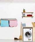 Wall Mounted Retractable Laundry Drying Rack With Wood Look Finish 40 Inch Wide Space Saving Clothes Dryer holding colorful clothes.