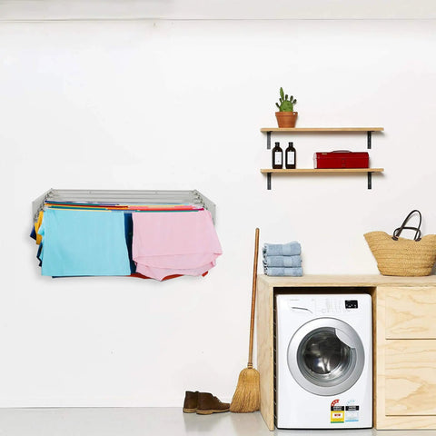Wall Mounted Retractable Laundry Drying Rack With Wood Look Finish 40 Inch Wide Space Saving Clothes Dryer holding colorful clothes.