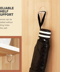 20 Pack Legit Heavy Duty Adhesive Shelf Brackets With Rock Solid Self Stick Backing For Kitchen Cabinets And Closets No Sweat Tool Free Install attached to wall, holding a black umbrella.