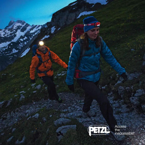Hikers wearing Pixa 3R Rechargeable Headlamp With Adjustable Headband Hands Free Night Light For Hiking Camping Running And Work Tasks Long Battery Life Bright LED Beam Durable Comfortable Fit E78CHR Ready, trekking in mountains.
