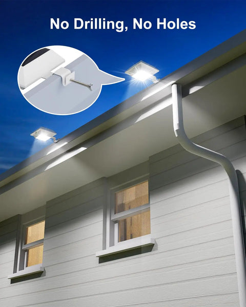 Four Pack White Solar Powered Gutter Lights Outdoor Decorative Waterproof 12 LEDs Yard Lamps illuminating a house gutter
