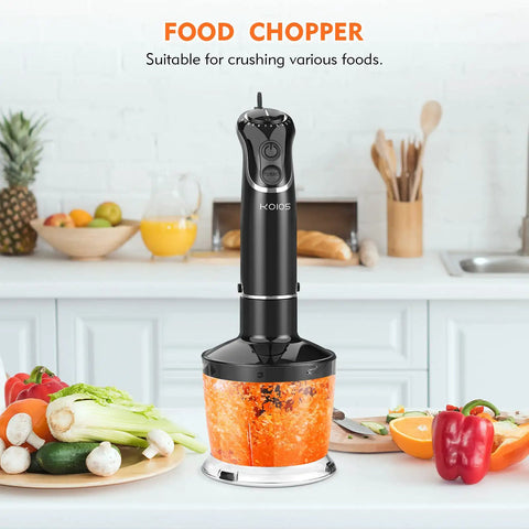 Slick Hands Down Game Changer 800 Watt Immersion Hand Blender With 12 Speeds And Turbo Boost Titanium Reinforced Blade Bpa Free 4 In 1 Kitchen Combo Featuring Chopper And Egg Beater Tool on kitchen counter with chopped vegetables.