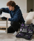 Person using the 148 Piece Automotive And Household Tool Set with Purple Case for home repairs, tools organized in molded slots.