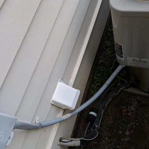 Go-To Flexible PVC Liquid Tight Conduit Kit 25 Ft 1-1/4 In Dia Non-Metallic Electrical Conduit installed outdoors with fittings