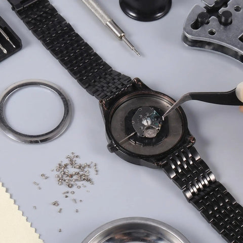 Straight Up Premium Watch Battery Clamp Screws Assortment Kit Hella Sturdy Stainless Steel Hardware No Hassle Essential For Precision Watchmaker Repairs And Dial Fixes, watch being repaired with tools.