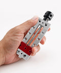 Nifty Mini Bench Vise Featuring Slick Bottom Slider And Precision Flat Jaws For Drill Press Work No Sweat Clamp Lock Solid 50mm Clamping Range, hand holding mini grip tool.