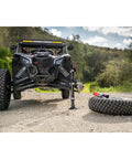 Electric High Lift Off Road Jack With 2000 LB Lift Capacity lifting ATV, showing 14 Inch Lift and 17 Inch Height Adjustment on trail