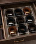 Keep Your Gear Legit With This Stackable Acrylic Belt Organizer featuring nine roomy compartments for belts in a drawer.