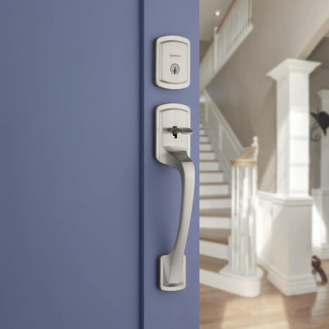 Prague Front Door Lock Handle and Deadbolt Set with Satin Nickel Finish on blue door, exterior entry and interior view