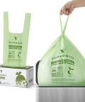 Person holding 13 Gallon Compostable Kitchen Trash Bag With Handles, 49.2L, 30 Count, 0.87 Mil Thick, 22.8 X 36.6 In, Biodegradable Bags