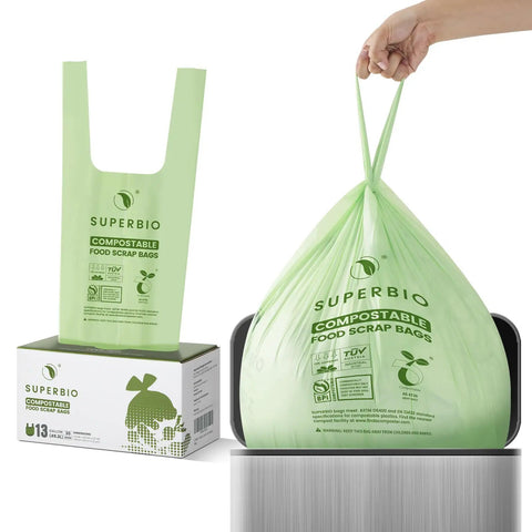 Person holding 13 Gallon Compostable Kitchen Trash Bag With Handles, 49.2L, 30 Count, 0.87 Mil Thick, 22.8 X 36.6 In, Biodegradable Bags