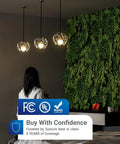 Room lit by hanging lamps, woman stands by green wall, FCC and UL certification badges displayed, emphasizing safety and quality.