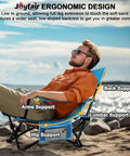 Man reclining on Heavy Duty Folding Beach Chair Set, 2 Pack For Outdoors, showing ergonomic design and support features.