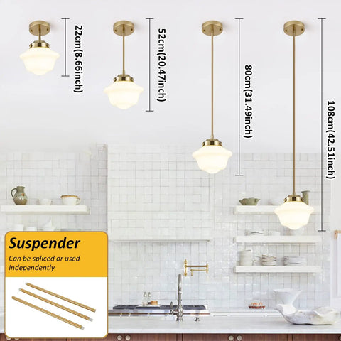 Kitchen with modern pendant lights of varying heights, gold finish, above a white-tiled backsplash and shelves.