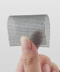 Heavy Duty Window Screen Repair Tape And Mesh Patch Kit 2 Inches By 16 Feet Long Black Adhesive Strip held in hand.