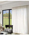 Heavy Duty Ceiling Curtain Track System With Smooth Silent Pulleys And Double Aluminum Runners Paired With A Slick Cornice Cover For Total Blackout and sheer curtains in bright room.