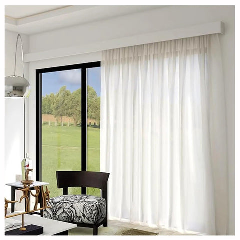 Heavy Duty Ceiling Curtain Track System With Smooth Silent Pulleys And Double Aluminum Runners Paired With A Slick Cornice Cover For Total Blackout and sheer curtains in bright room.