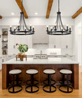 Black Farmhouse Wagon Wheel Chandelier With Six Lights, 24 Inch Rustic Pendant Ceiling Light in modern kitchen setting.